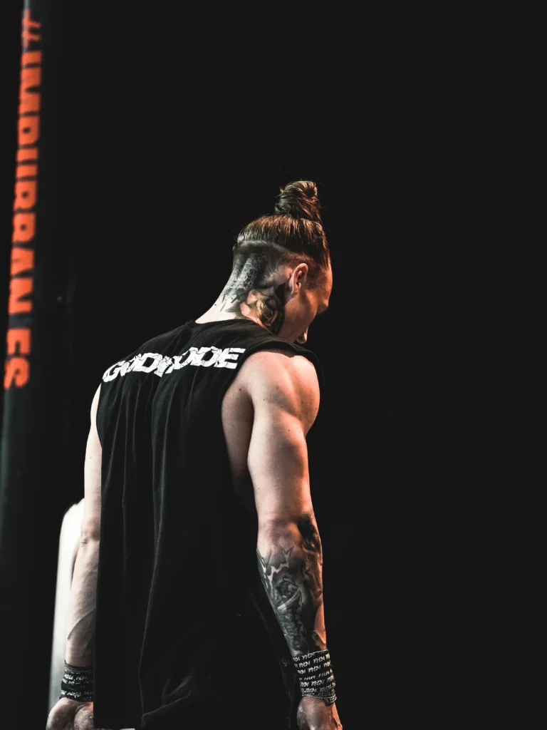 Pro athlete Daniels Laizans in action, competing at a high level in the RHSM Godmode Tank Top.
