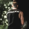Daniels Laizans preparing for his set on a competition stage while wearing the RHSM Godmode Tank Top.