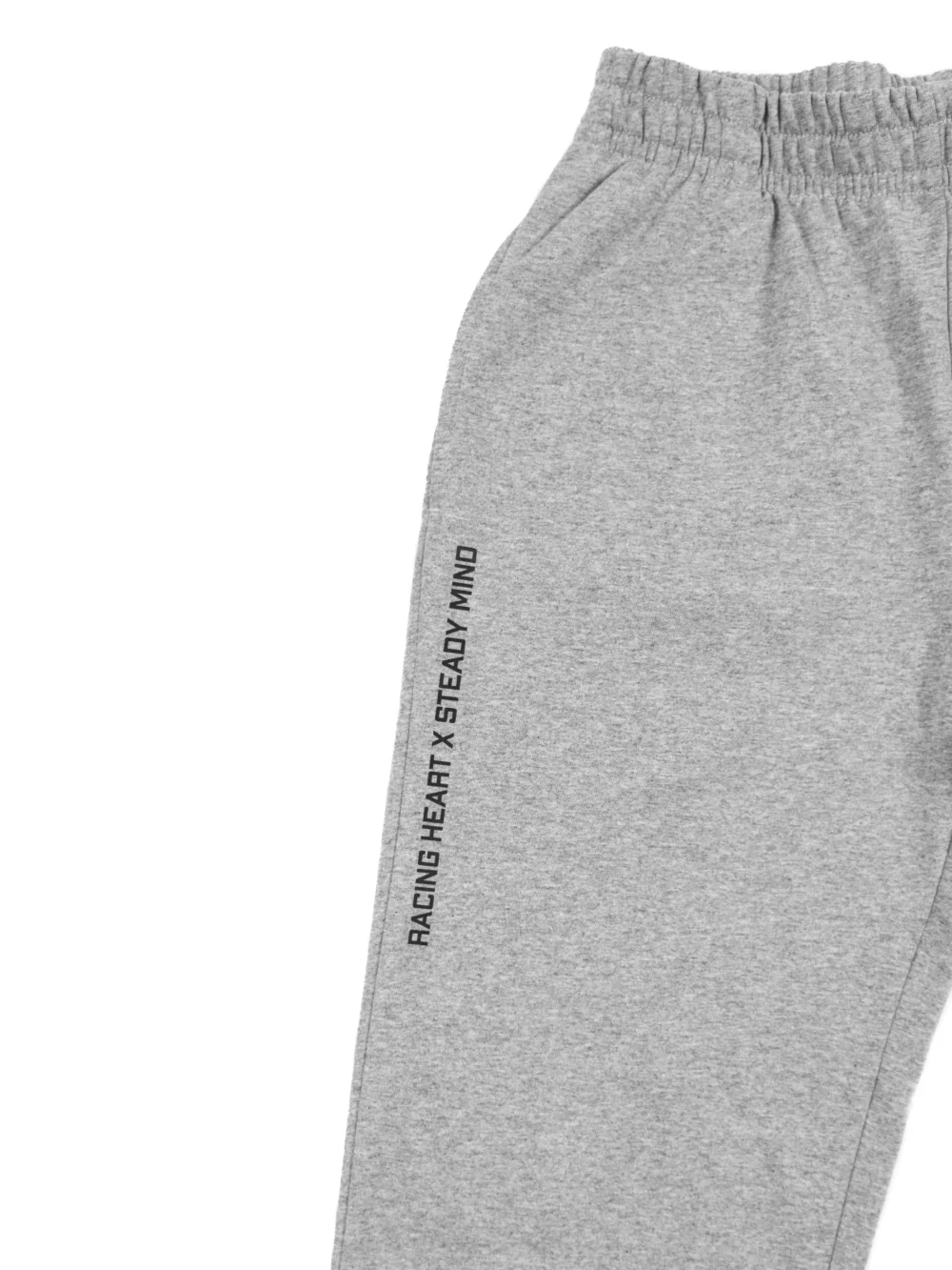 A close-up of the "Racing Heart X Steady Mind" graphic on the pocket of the gray RHSM Classic Fit Sweatpants.