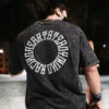 An athlete wearing the RHSM Acid Wash Tee outdoors, with a clear view of the back graphic.
