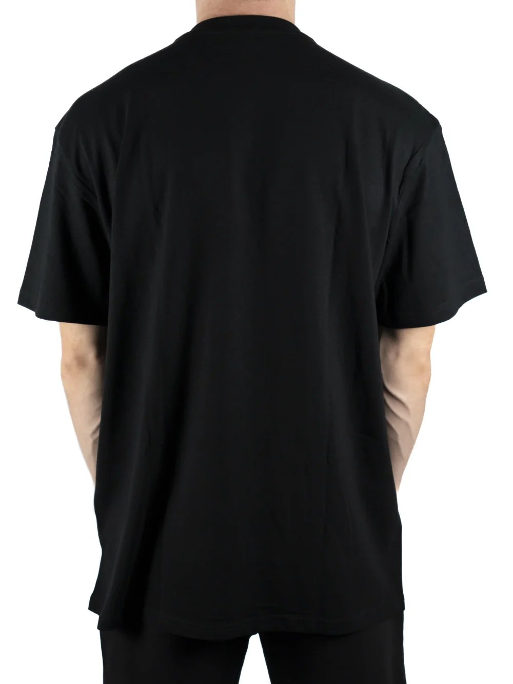 Back view of a model wearing the black RHSM Flowstate Tee, showing its relaxed and comfortable fit.