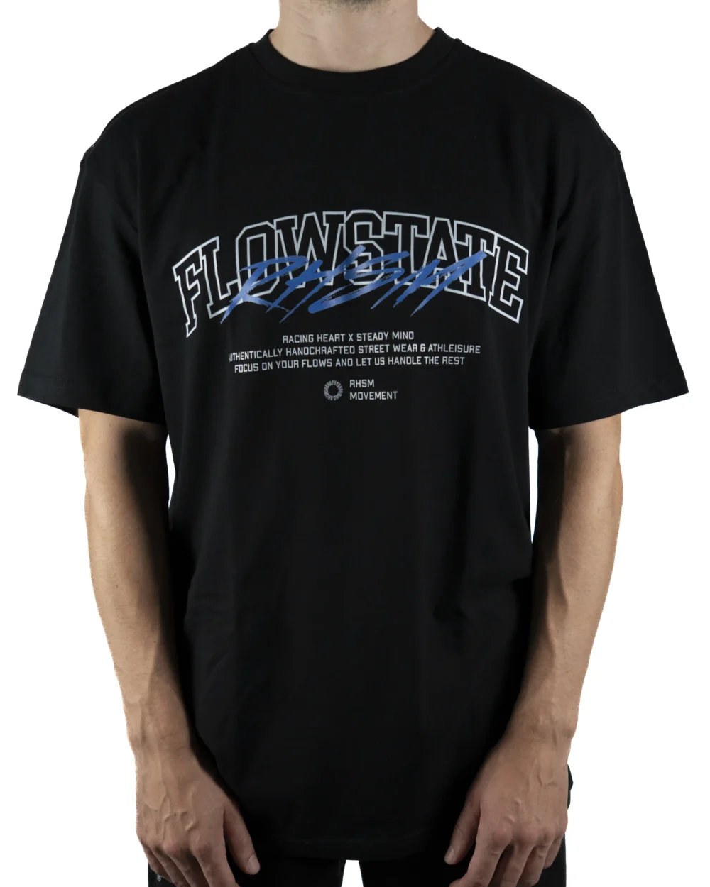 Front view of a model wearing the black RHSM Flowstate Tee, demonstrating its oversized fit with dropped shoulders.