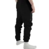 Back view of a model wearing the black RHSM Classic Fit Sweatpants.