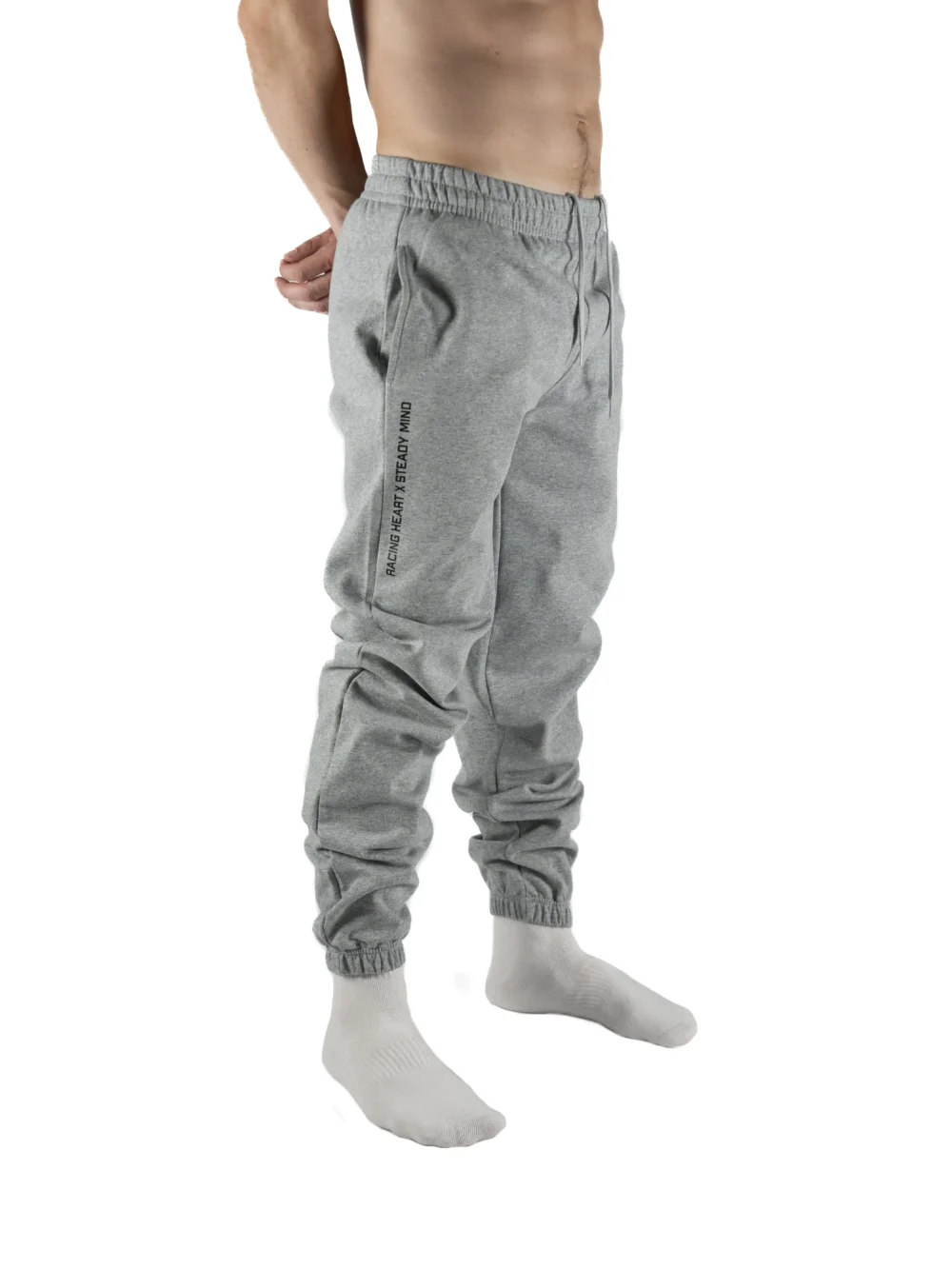Front view of a model wearing the gray RHSM Classic Fit Sweatpants, showing the comfortable athletic fit.