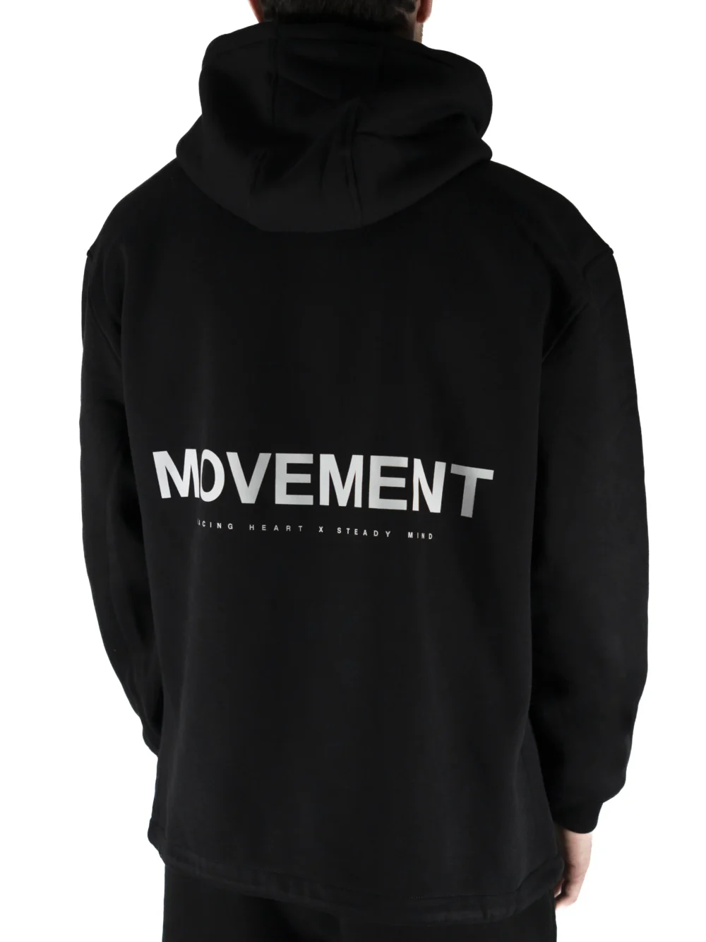 Back view of a model wearing the black RHSM MVMT Hoodie, highlighting the designer-inspired "MOVEMENT" back graphic.