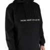 Front view of a model wearing the black RHSM MVMT Hoodie, showing its relaxed oversized fit.