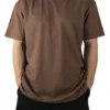 Front view of a model wearing the brown RHSM Movement Tee, showing its oversized fit and dropped shoulders.