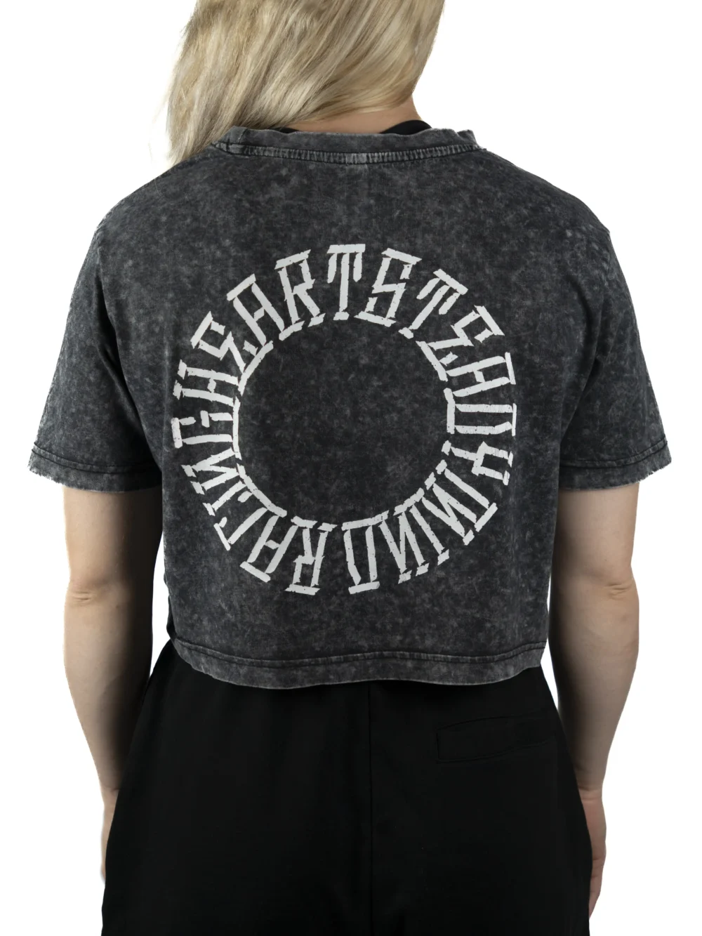 Back view of a model wearing the RHSM Acid Wash Crop-Top, showing the "Racing Heart Steady Mind" graphic.