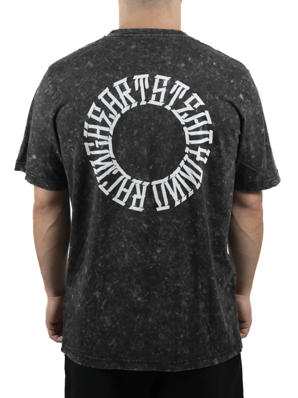 Back view of a model wearing the RHSM Acid Wash Tee, showing the "Racing Heart Steady Mind" graphic.
