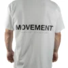 Back view of a model wearing the white RHSM Movement Tee, highlighting the designer-inspired back graphic.