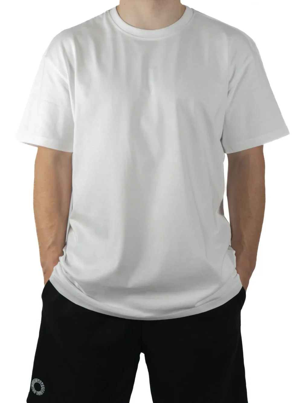 Front view of a model wearing the white RHSM Movement Tee, showing its oversized fit and dropped shoulders.