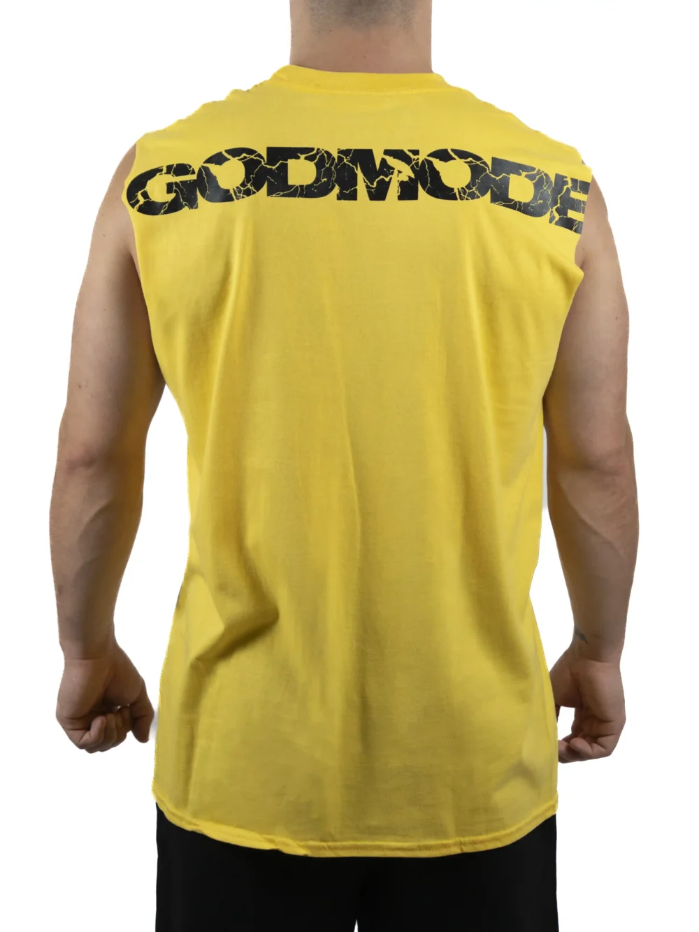 Back view of a model wearing the yellow RHSM Godmode Tank Top, showing the "GODMODE" graphic.