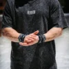 An athlete wearing the RHSM Acid Wash Tee outdoors, showcasing its comfortable oversized fit.