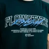 Detailed close-up of the screen-printed graphic and 100% premium cotton fabric of the black RHSM Flowstate Tee.