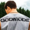 Back view of an athlete wearing the gray RHSM Godmode Tank Top during an outdoor street workout.