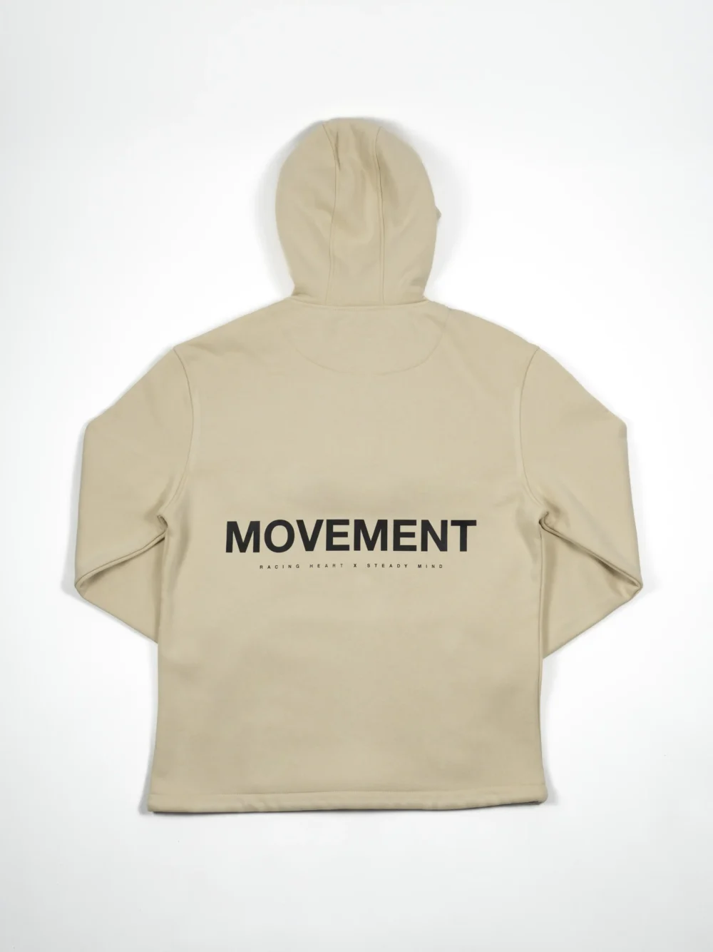 The back of the beige RHSM MVMT Hoodie laid flat, showcasing the minimalist "MOVEMENT" back graphic.