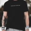 A full front view of a model wearing the black RHSM Classic Fit Tee in an outdoor setting.