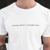 An outdoor close-up shot of a model wearing the white RHSM Classic Fit Tee.