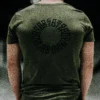 Back view of a model wearing the khaki RHSM Long Fit Tee V2 outdoors, with a clear view of the back graphic.
