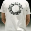 Back view of a model wearing the white RHSM Long Fit Tee V2 outdoors, with a clear view of the back graphic.