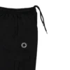 A close-up view of the spacious side cargo pocket on the black RHSM Sweatpants, perfect for training essentials.
