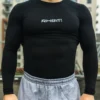 A close-up of the front of the black RHSM Compression Shirt, highlighting the material and compression fit.