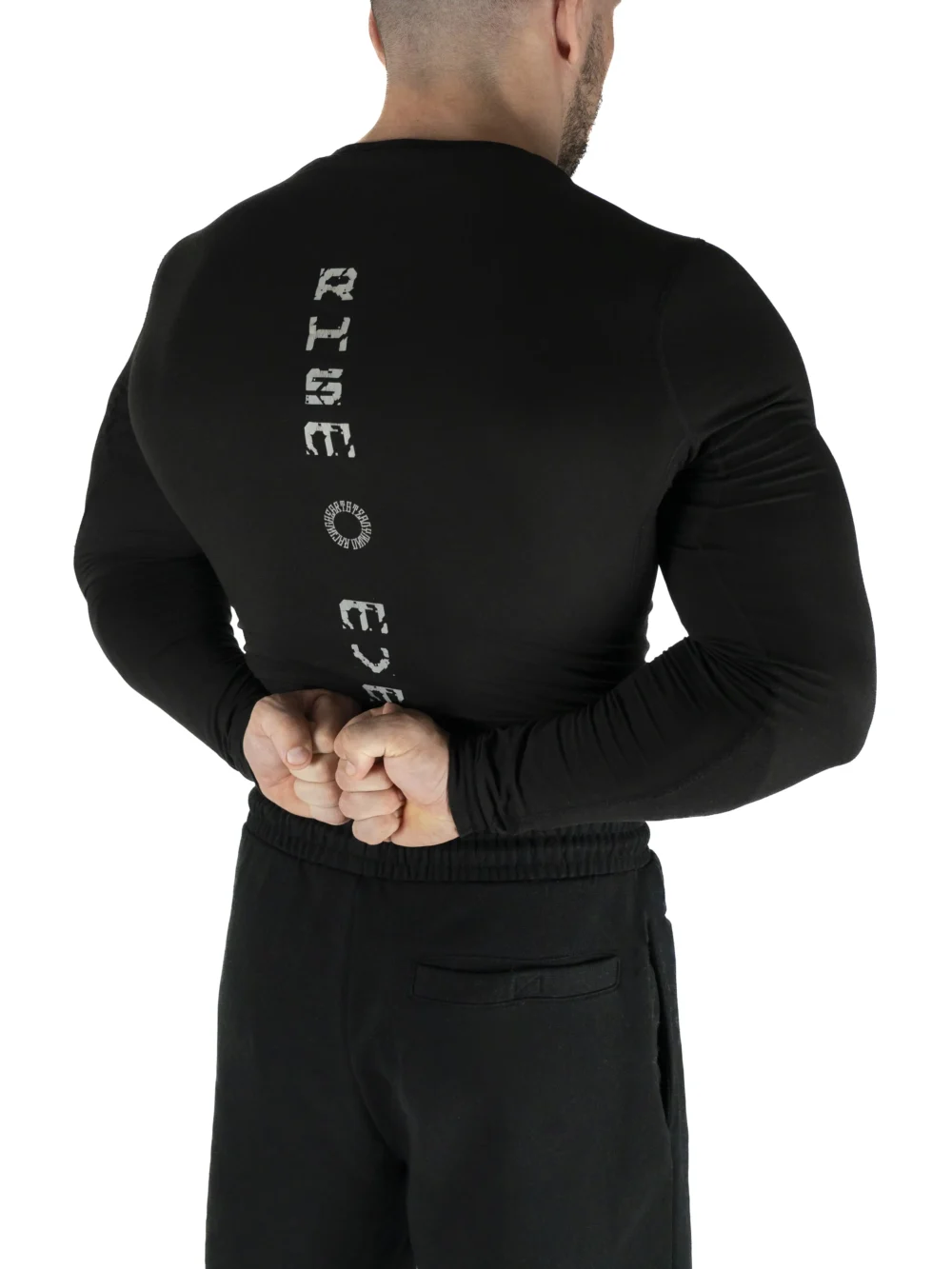 Back view of a model wearing the black RHSM Compression Shirt.