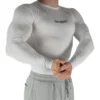 Front view of a model wearing the white RHSM Compression Shirt, showing its supportive fit.