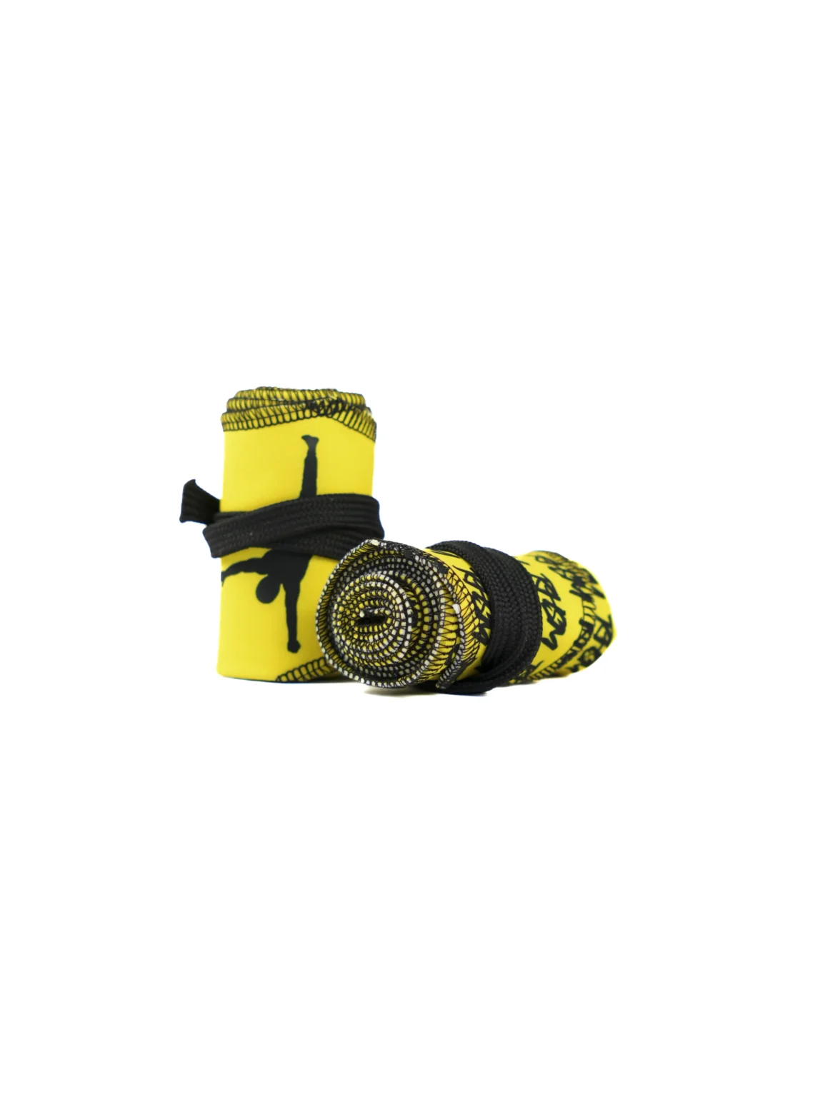 A close-up of the yellow RHSM Calisthenics Wrist Wraps V2, rolled up and ready for a workout.