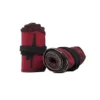 A close-up of the red RHSM Calisthenics Wrist Wraps V2, rolled up and ready for a workout.