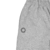 Closeup of the embroidered RHSM First Edition emblem on the pocket of the gray sweatpants.