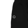 Closeup of the embroidered RHSM First Edition emblem on the pocket of the black sweatpants.