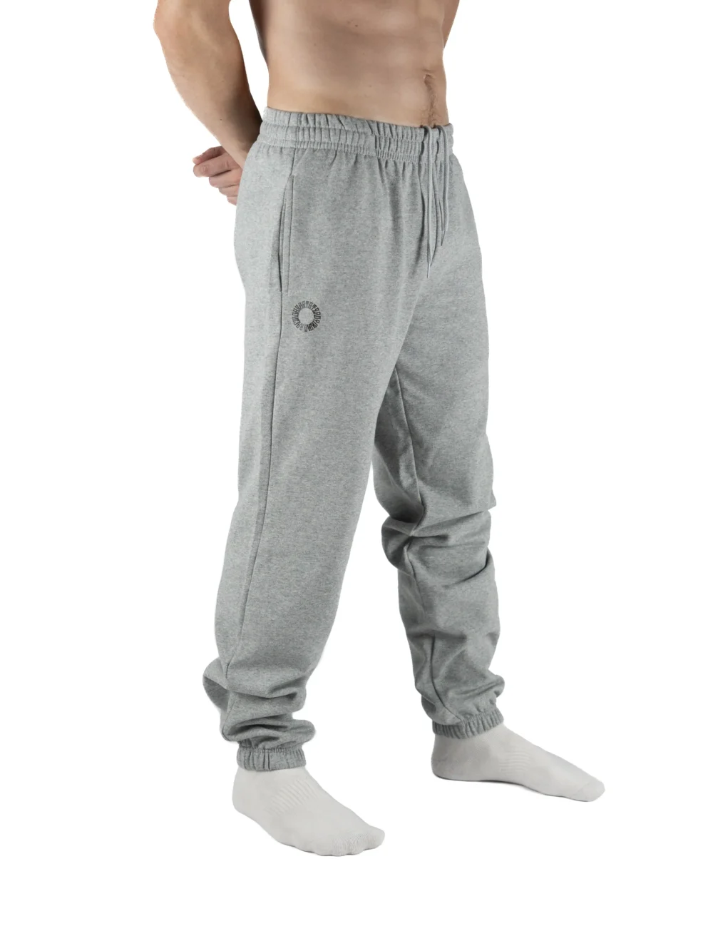 Male model wearing the gray RHSM First Edition sweatpants, showing the relaxed oversized fit from the front.