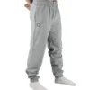Male model wearing the gray RHSM First Edition sweatpants, showing the relaxed oversized fit from the front.