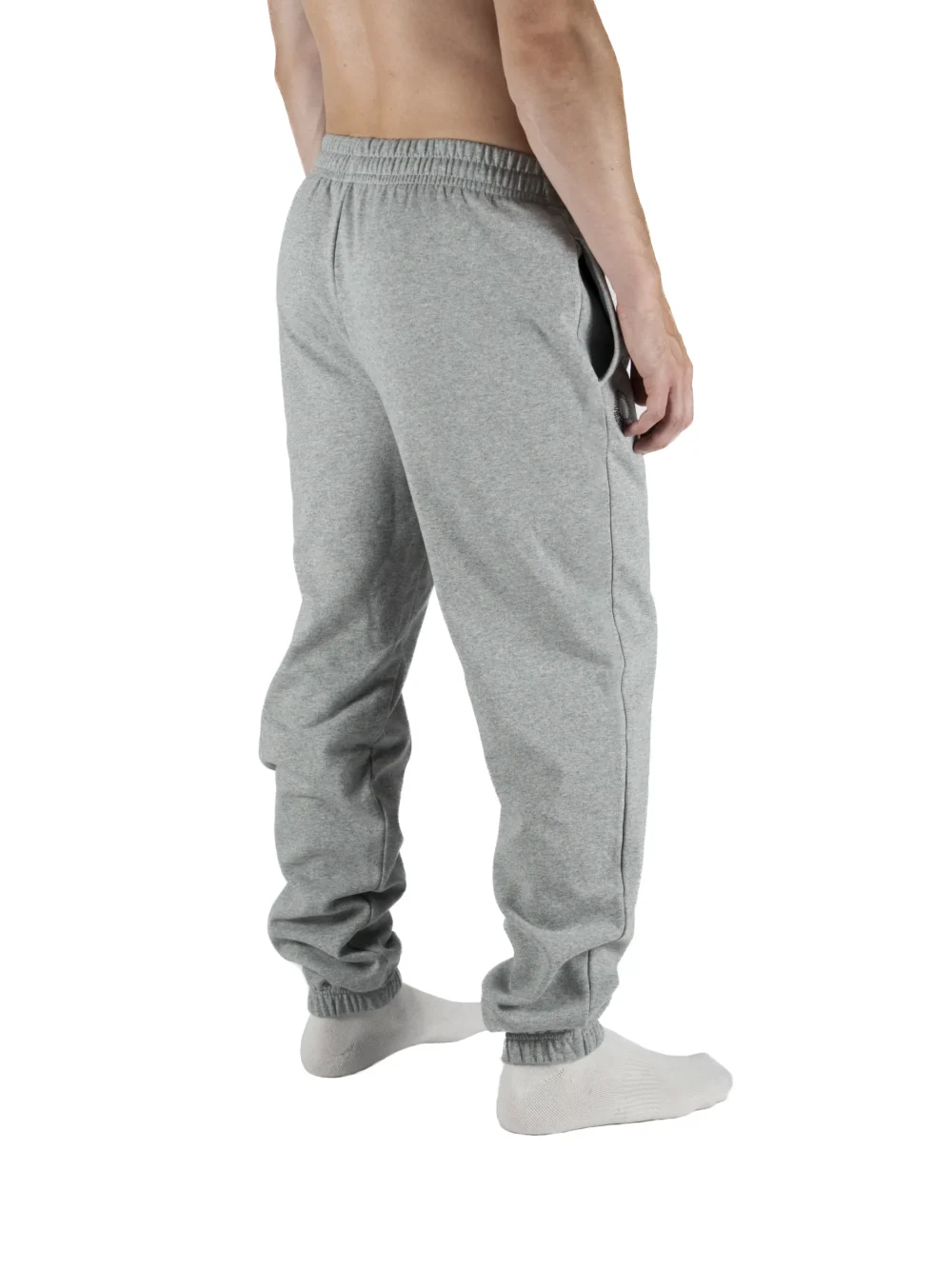 Male model wearing the gray RHSM First Edition sweatpants, showing the fit and silhouette from the back.