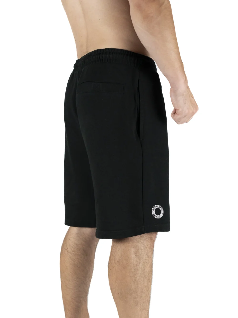 Male model wearing the black RHSM First Edition shorts, showing the silhouette and fit from the back.