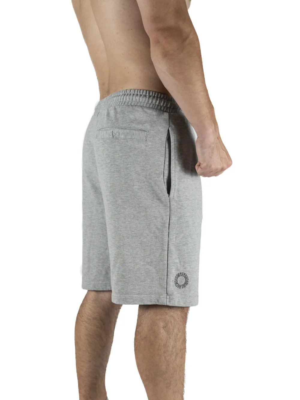 Male model wearing the gray RHSM First Edition shorts, showing the silhouette and fit from the back.