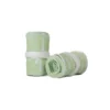 A pair of the pastel green RHSM Calisthenics Wrist Wraps V2 rolled up and ready for training.