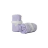 A pair of the pastel lilac RHSM Calisthenics Wrist Wraps V2 rolled up and ready for training.