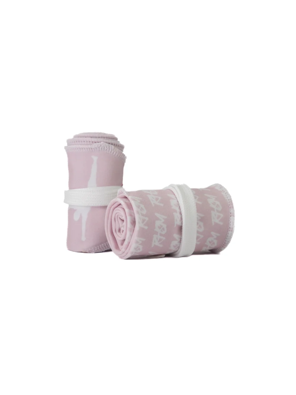 A pair of the pastel pink RHSM Calisthenics Wrist Wraps V2 rolled up and ready for training.