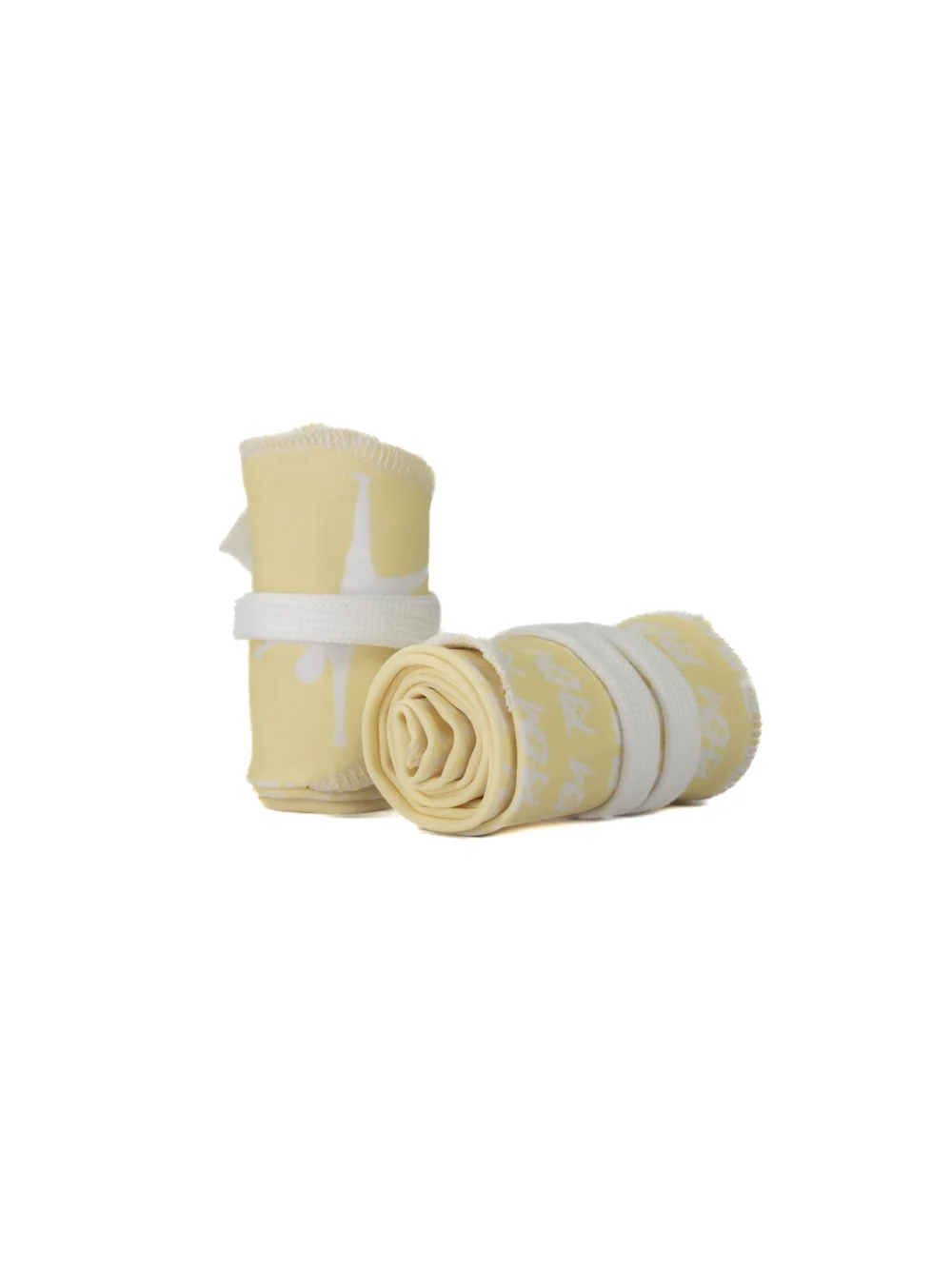 A pair of the pastel yellow RHSM Calisthenics Wrist Wraps V2 rolled up and ready for training.