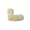 A pair of the pastel yellow RHSM Calisthenics Wrist Wraps V2 rolled up and ready for training.