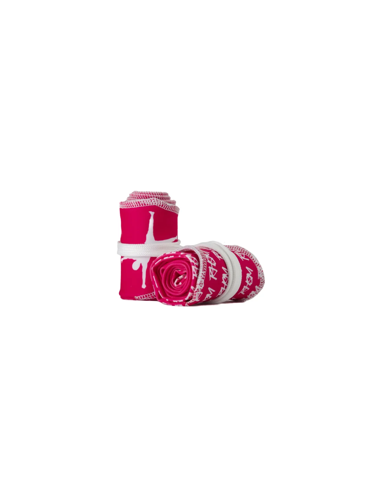 A pair of the pink RHSM Calisthenics Wrist Wraps V2 rolled up and ready for training.