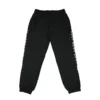 The RHSM "GODMODE" Trackpants in black, laid flat (front view), showcasing the technical 100% polyester fabric of this performance apparel.