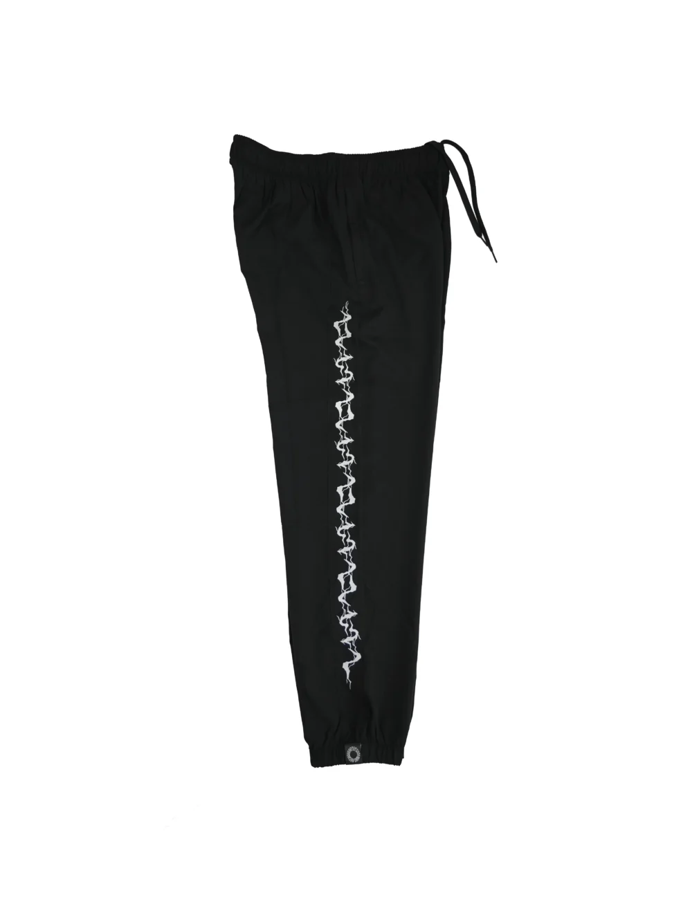 The black GODMODE trackpants laid flat (side view), displaying the iconic lightning graphic that defines this piece of fitness apparel.