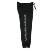 The black GODMODE trackpants laid flat (side view), displaying the iconic lightning graphic that defines this piece of fitness apparel.