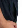 A close-up shot of the secure zipper pocket on the navy GODMODE trackpants, essential for any high-performance fitness apparel.