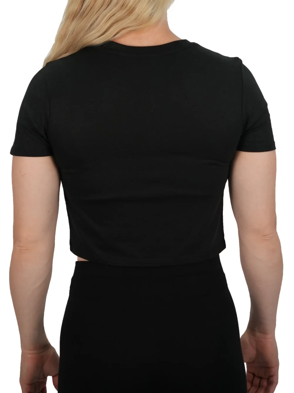 Back view of a female athlete wearing the black Classic Fit Crop Top, highlighting the clean, plain back and the athletic fit across the shoulders.