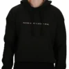A female model wearing the Classic Fit Cropped Hoodie, showcasing its tailored cropped fit, the minimalist front graphic, and the kangaroo pouch pocket.