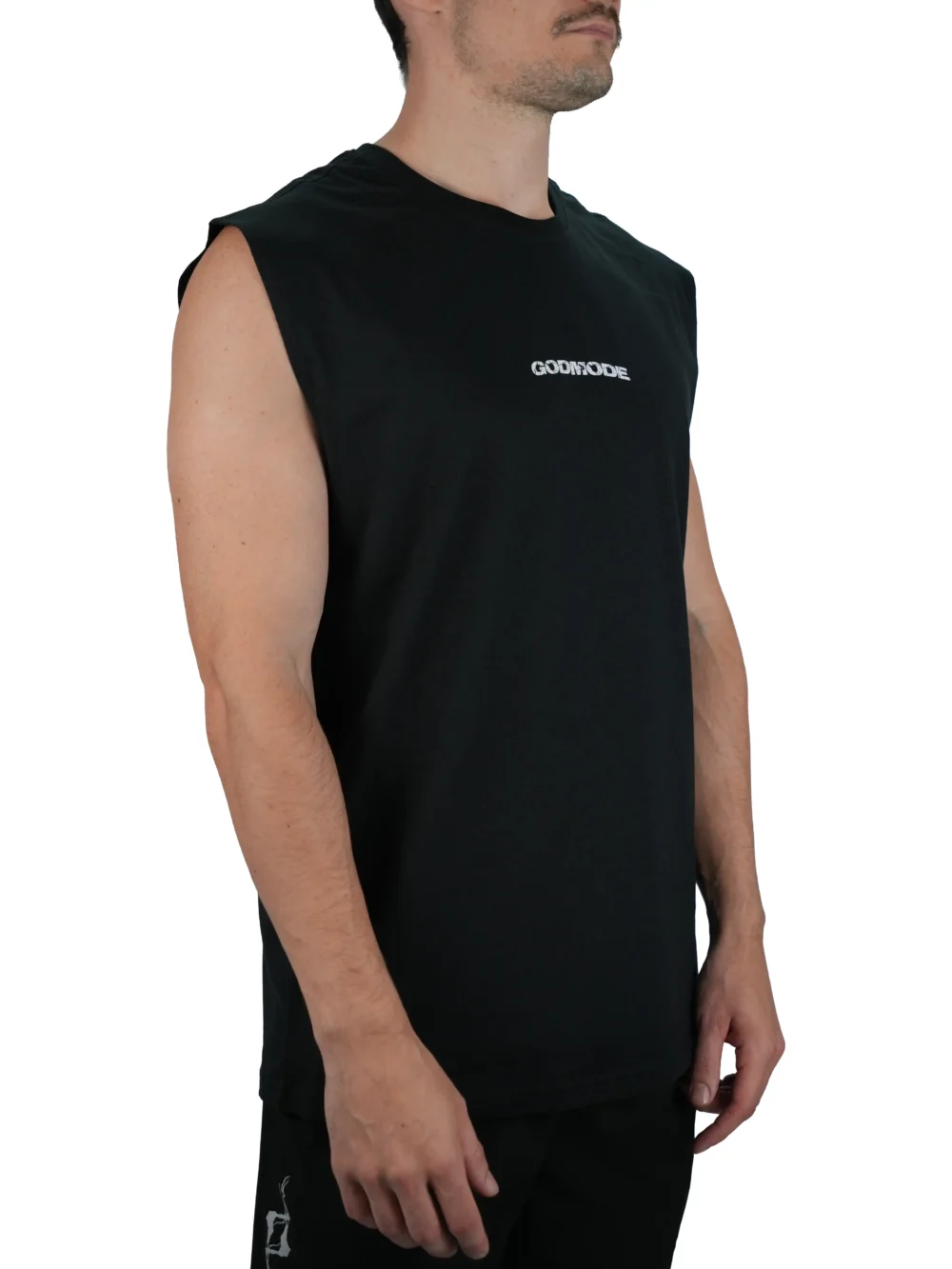 Model wearing the black GODMODE V2 oversized tank (front view), demonstrating the comfortable loose fit of this premium workout gear.